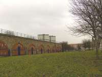 Site of Cumberland Street station looking east from Eglinton Street in February 2010. The area in the foreground was part of the large original station, which had entrances on both Cumberland Street [see image 13587] and Eglinton Street. Following closure in 1966 the Eglinton Street entrance was demolished and the route reduced from four to two tracks, with this area being landscaped to create an open space for the benefit of occupants of the new housing being built nearby.<br><br>[Graham Morgan 16/02/2010]