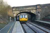 Northern Rail 142057 seen leaving Upholland station heading towards Wigan on 10 Februry 2010.<br>
<br><br>[John McIntyre 10/02/2010]