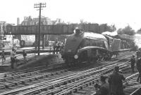 Timeous admonition on the footbridge (Vote for Cliff?) as 60019 <I>Bittern</I> moves off a recently arrived train at the north end of Aberdeen station. The date is 3 September 1966 and 60019 has just completed the last BR scheduled run north by an A4 from Buchanan Street. [Railscot addendum: The message on the bridge refers to an election for a new rector of Aberdeen University and the Cliff in question was Cliff Michelmore. With thanks to Denis Coutts]<br><br>[Colin Miller 03/09/1966]