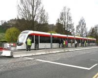 The Mound tram stop on Princes Street, with a service for Edinburgh Airport having recently arrived... by crane. The latest Edinburgh tram exhibit on display on 29 April 2010, although this one is the genuine article as opposed to the previous mock-up [see image 5137].  <br><br>[John Furnevel 29/04/2010]
