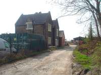 The station building at Milnthorpe, still in non-railway use alongside the WCML in April 2010, over forty years after closure. The platforms have long gone but the distinctive original Lancaster and Carlisle Railway building remains. Straight ahead is the road haulage depot that now occupies the old goods yard.<br><br>[Mark Bartlett 17/04/2010]