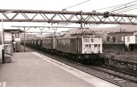 76038+76035 double-head a coal train westbound through Hadfield on 3 July 1978.<br>
<br><br>[Peter Todd 03/07/1978]