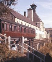 Children leaving an Aviemore-Elgin railbus during the summer of 1961 at one of the five simple wooden halts opened on the Speyside Line by BR two years previously. This one is Gilbey's Cottages Halt, near Knockando, complete with camping coach.<br><br>[Frank Spaven Collection (Courtesy David Spaven) //1961]