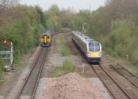 The eastern approach to Poulton-le-Fylde. Semaphore signals still control the trains here although the former through lines have been taken out of use. In the foreground are the remains of the eastern end of the island platform, recently removed as part of a refurbishment [See image 28706]. Adelante 180103 is heading for Blackpool North while 158817 is going to York. <br><br>[Mark Bartlett 27/04/2010]