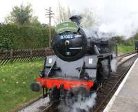 BR Standard class 4 tank no 80002 runs round its train at Oxenhope station on the Keighley & Worth Valley Railway on 3 May 2010. The last time I had seen 80002 in steam was at Cowlairs on 24 February 1968 when it was in use as a carriage heating loco. Today it still sports a 66A shedplate, has 'Polmadie' on the buffer beam and the number plate has a BR (ScR) blue background.<br>
<br><br>[John McIntyre 03/05/2010]