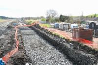 View east at Forrestfield, looking over the part of the former station site where drainage problems now appear to have been resolved [see image 26557]. The brick building on the right is the remains of an old lamp room and stood at the rear of the now demolished westbound platform.<br><br>[John Furnevel 02/05/2010]