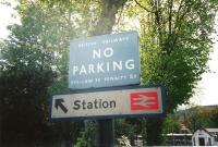 A relic seen outside Pitlochry station in May 1995: a British Railways era No Parking notice on a post made of a bullhead rail. As the trespass notices of the era threatened a fine 'Not exceeding 40/-' (2) the 5 penalty for a parking infringement seems a bit steep.<br>
<br><br>[David Panton /05/1995]