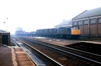 A Type 2 has just passed Banbury South signal box with a down freight in March 1979 and is about to run through Banbury station on the relief line. [See image 28866]<br>
<br><br>[John Furnevel 10/03/1979]