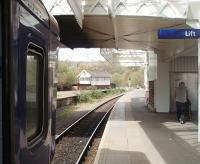 The surviving island platform at Halifax handles all services and is accessed by the overbridge seen here in this view towards Bradford. The signal box controls the colour lights in the station and also nearby Dryclough Junction where the line to Sowerby Bridge and the reopened Greetland line split. 155343 waits to depart for Leeds on 24 April.<br><br>[Mark Bartlett 24/04/2010]