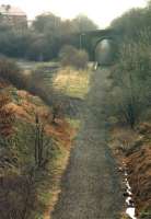 Looking over the site of Skelmanthorpe Station towards Clayton West in March 1988 after standard gauge track had been lifted. This is now part of the route of the 15 inch gauge Kirklees Light Railway.<br><br>[David Pesterfield 22/03/1988]