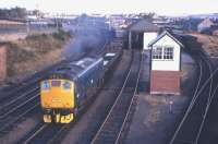 No, not the long-haul express freight to the Midland Region which the headcode might imply, but rather the shorter than usual 16.10 Invergordon-Inverness trip freight heading south on 24th October 1972. Standing out in the consist are four wagons of aluminium blocks from the smelter, four alumina hoppers for Fort William via Cadder Yard (330 miles!), plus two Speedfreight containers and two tank containers from the Invergordon Distillery. <br>
<br><br>[Frank Spaven Collection (Courtesy David Spaven) 24/10/1972]