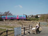 A subway gives access to the western end of the lengthy promenade at Grange and a Transpennine 185 unit runs over this on its way from Barrow to Manchester Airport on 17 April.  <br><br>[Mark Bartlett 17/04/2010]