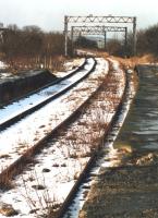 View west at Penistone Station looking towards Manchester along the then remaining section of the former Woodhead route in February 1988, with the home signal still in place.<br><br>[David Pesterfield 10/02/1988]