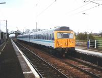 You can almost smell the paint as freshly outshopped 305 502 stands at Prestonpans in April 1995 with a service for Edinburgh. Travel on this stock was an 'Alton Towers' experience - I don't imagine that many people fell asleep and missed their stop on this line.<br><br>[David Panton /04/1995]