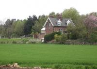 The old station House at Haigh (closed 1965), sited on the down side of the Wakefield to Barnsley line approximately 500metres south of Woolley Tunnel south portal. The former station is only 100metres across a field from the M1 motorway, near junction 38, and faces the grounds of the Yorkshire Sculpture Park beyond the motorway. There were calls some years ago to reopen the station to give easy non-car access to the Sculpture Park, unfortunately to no avail. <br><br>[David Pesterfield 08/05/2010]