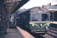 Passengers leaving the mid-morning railbus arrival from Gleneagles amongst the still-imposing surroundings of Crieff station on a fine summer's day in 1961. [See image 27554]<br><br>[Frank Spaven Collection (Courtesy David Spaven) //1961]