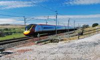 A northbound service passes the access point at Scout Green on its way north.<br><br>[Ewan Crawford 12/04/2010]