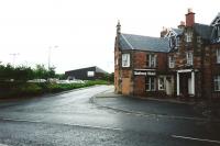 The site of St Boswells station in July 1994, across the road from a (then) giveaway-named hotel.  The Station building was approximately where that shed is, and the line bridged the road to the left of the picture<br><br>[David Panton /07/1994]