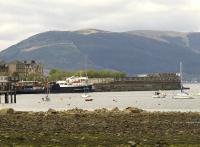 A view of Gourock on 5th May 2010, showing the CalMaC ferry DSMV <I>Jupiter</I> at the pier and a ScotRail Class 334 unit standing inside a tired and very shabby looking station. Thankfully this is being put right by Network Rail who are rebuilding the station. [See image 39241]<br><br>[Graham Morgan 05/05/2010]