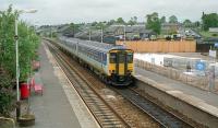 An eastbound Sprinter enters Elgin (formerly Elgin West). On the right the <i>new</i> station building is under construction.<br><br>[Ewan Crawford //1989]