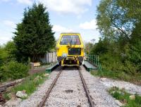 The tamper brought in to fettle the ballast on the southern Mouldon Hill Extension of the Swindon and Cricklade Railway, photographed at Blunsdon on 15 May 2010. After three passes, apparently the track can handle 70mph trains. We are now able to run over an extra 3/4 mile of new track. <br>
<br><br>[Peter Todd 15/05/2010]