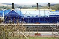 Progress at Sanquhar station on 16 April 2010 looking west across the running lines. The building is shown here prior to slating and with the logia along the front of the building now reinstated (the right side of which will become an enclosed dining area). [See image 28960]<br><br>[Peter Rushton 16/04/2010]