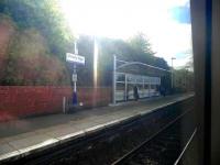 A view from a train at Falkirk High on 14 May 2010, showing one of the new shelters being provided by ScotRail at Edinburgh & Glasgow<br>
stations. View looking across to the westbound platform.<br><br>[John Yellowlees 14/05/2010]