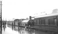 HR 103 stands alongside a rainsoaked platform at Inverness in August 1965 with one of the shuttle specials that ran to and from Forres that week in connection with the Highland Railway centenary celebrations. <br><br>[K A Gray /08/1965]