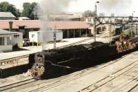 A South African Railways Class 15F 4-8-2 no 3150, built by the North British Locomotive Company, photographed on a trip working at Germiston, South east of Johannesburg, in 1991.<br><br>[Ken Strachan 25/02/1991]