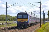 322 484 passes St Germains level crossing with a North Berwick - Edinburgh service on 17 May.<br><br>[Bill Roberton 17/05/2010]