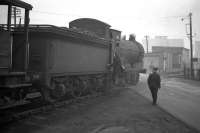 Lots of railwaymen in attendance as a J35 shunts in Gorgie East yard in 1961 - in the distance are the Westfield multi-storey flats (the first in Edinburgh), which can still be glimpsed from E&G trains just west of Haymarket West junction.<br><br>[Frank Spaven Collection (Courtesy David Spaven) //1961]