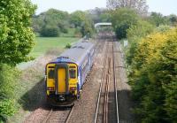 The 1410 service to Newcastle (ex-Glasgow Central) seen just after leaving Annan station on 13 May having passed below Station Road bridge. The train is approaching the signal that, prior to the summer of 2008, marked the start of the single line section to Gretna. For a view looking back from the footbridge in the background during single line days [see image 19966].   <br><br>[John Furnevel 13/05/2010]