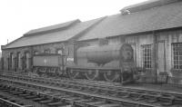 Lonely looking McIntosh 3F 0-6-0 no 57568 stands alongside the west wall of Beattock shed in March 1964. The ex-Caledonian 1899 veteran had been officially withdrawn from 66B Motherwell at the end of 1963.<br><br>[K A Gray 29/03/1964]
