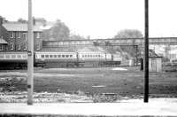 A northbound InterCity 125 empty stock working takes the York station avoiding line from Holgate Junction in July 1980. View south west from the platforms over land once occupied by various railway facilities including the NER's York South roundhouses. [Note the infilled remains in the foreground.]<br><br>[John Furnevel 20/07/1980]