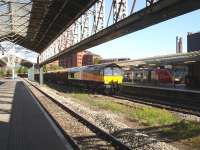 Colas Rail 66843 runs west through Chester station at 17.30 on 11 May with a lengthy timber service heading for Kronospan at Chirk. This was the second working that day, as DRS Fastline liveried 66434 worked empty wagons north through Wrexham General around 13.30. <br><br>[David Pesterfield 11/05/2010]