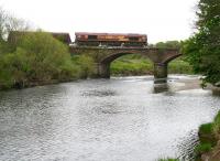 EWS 66238 crosses the River Nith on Martinton Bridge with a southbound coal train in May 2010 on the approach to Dumfries station.<br><br>[John Furnevel 13/05/2010]