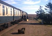 Hunters, shooters and fishers offload gear from an Inverness-Wick train at Altnabreac in the summer of 1971, doubtless heading for the up-market Lochdhu Hotel a mile across the moor. The photographer camped overnight at this isolated station, and in the evening wandered over the then treeless expanse (like something out of Dr Zhivago) to the hotel, to find himself in a cocktail bar full of elaborately attired ladies and gentlemen... <br><br>[David Spaven //1971]