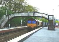 Southbound Stobart containers speed through Pitlochry station on 19 May 2010 behind 66115.<br><br>[Colin Miller 19/05/2010]