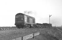 Class 20 no 8322 just west of Niddrie West Junction with a short train of track panels on 4 February 1970.<br>
<br><br>[Bill Jamieson 04/02/1970]