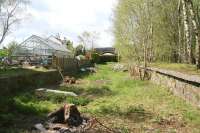 Standing between the remains of the platforms at New Galloway on 12 May. The view is west towards Stranraer with the converted station house in the left background [see image 29120]. Beyond the road bridge the trackbed is now a walkway leading to Loch Skerrow and Gatehouse station.<br>
<br><br>[John Furnevel 12/05/2010]