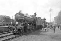 Class K1 2-6-0 no 62005, with D5160 tucked in behind, takes on water during a photostop at Leyburn on 20 May 1967. The special is the SLS <I>Three Dales Railtour</I> on its way back to Darlington following a visit to Redmire.<br><br>[Robin Barbour Collection (Courtesy Bruce McCartney) 20/05/1967]