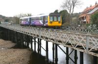 Northern 142078 crosses the Esk at Ruswarp on 23 March with the 10.38 Middlesbrough - Whitby service.<br><br>[John Furnevel 23/03/2010]