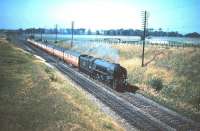 A southbound train on the ECML runs through the site of (33 years later) the modern day Musselburgh station in the summer of 1955 behind Gateshead A1 Pacific no 60132 <I>Marmion</I>. The photograph was taken from the north side of the bridge carrying Whitehill Farm Road. [See image 8476]<br><br>[A Snapper (Courtesy Bruce McCartney) 16/07/1955]