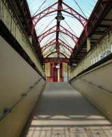 View up the ramp from lower street access level to the platforms at Dumbarton Central in May 2010.<br><br>[Alistair MacKenzie 28/05/2010]