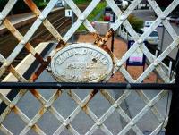 A plate on a footbridge at Pitlochry station in May 2010. H D & W was a major engineering company building ships, engines, a variety of heavy machinery and structural ironwork - such as the roof of Waverley Station (source:  'Paisley, a History' by Sylvia Clark). [See image 15547]<br>
<br><br>[Colin Miller 19/05/2010]