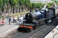 Ex-Somerset & Dorset 2-8-0 no 88 prepares to take a train out of a sunny Bishops Lydeard station on the West Somerset Railway on 30 May 2010.<br><br>[Peter Todd 30/05/2010]