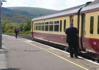 The driver of the 1102 to Stranraer has collected the token from the Girvan signalman on 26 May and is ready to set off south with unit 156 514.<br><br>[Colin Miller 26/05/2010]