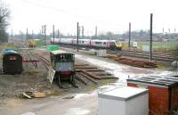 A CrossCountry service runs north through the site of Tollerton station in the Vale of York on 25 March 2010. Nothing remains of the station, which closed to pasengers in 1965, but the site sees regular use nowadays by engineering and maintenance staff.<br><br>[John Furnevel 25/03/2010]