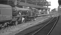 The driver of Gresley V3 2-6-2T no 67651 checks the road as he waits to leave Newcastle Central in the 1960s with empty stock for Heaton.<br><br>[K A Gray //]