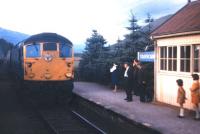 A fair 'puckle' of business for this Kyle-bound train as it pulls into Strathcarron station in the summer of 1972.<br><br>[David Spaven //1972]